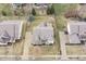 Overhead shot showcasing a property's roof, driveway, and well-maintained lawn in a suburban setting at 10264 Normandy Way, Fishers, IN 46040