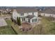 Wonderful view of a backyard patio with a beautiful home elevation and trimmed trees at 10264 Normandy Way, Fishers, IN 46040