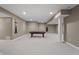 Large finished basement with a stylish support beam, neutral colored walls and carpet flooring at 10264 Normandy Way, Fishers, IN 46040