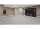 Finished basement featuring a stylish dark wood entertainment center and neutral colored walls at 10264 Normandy Way, Fishers, IN 46040