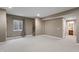 Spacious finished basement with a staircase, window and carpet flooring at 10264 Normandy Way, Fishers, IN 46040