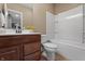 Bathroom with a wood vanity, tile floors, and a tub and shower combo at 10264 Normandy Way, Fishers, IN 46040