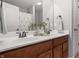 Bathroom features a double wood vanity, neutral walls, and decorative mirrors at 10264 Normandy Way, Fishers, IN 46040