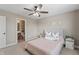 Bedroom features stylish decor, a ceiling fan, neutral walls, and an ensuite bathroom at 10264 Normandy Way, Fishers, IN 46040