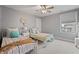 Bedroom features two beds, stylish decor, a ceiling fan, and neutral walls at 10264 Normandy Way, Fishers, IN 46040