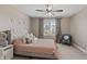 Bedroom features stylish decor, a ceiling fan, neutral walls, and a comfortable upholstered bed at 10264 Normandy Way, Fishers, IN 46040