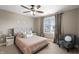 Bedroom features stylish decor, a ceiling fan, neutral walls, and a comfortable upholstered bed at 10264 Normandy Way, Fishers, IN 46040