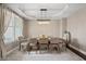 Bright dining room with stylish chandelier, tray ceiling, and hardwood floors at 10264 Normandy Way, Fishers, IN 46040