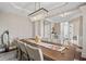 Bright dining room with chandelier, tray ceiling, and view to the entry foyer at 10264 Normandy Way, Fishers, IN 46040