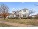 Elegant two-story house with manicured lawn and a stone-detailed entrance at 10264 Normandy Way, Fishers, IN 46040