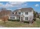 Aerial view of a two-story home with meticulously maintained landscaping and a charming facade at 10264 Normandy Way, Fishers, IN 46040