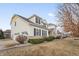 Side view of a two-story house showcasing a three-car garage and manicured landscaping at 10264 Normandy Way, Fishers, IN 46040