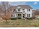 Charming two-story home featuring a stone-accented entrance and beautifully landscaped front yard at 10264 Normandy Way, Fishers, IN 46040