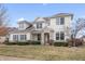 Inviting two-story home featuring dormer windows and a stone-accented entryway at 10264 Normandy Way, Fishers, IN 46040