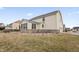 Exterior view of home featuring a sunroom with many windows and large yard at 10264 Normandy Way, Fishers, IN 46040