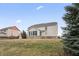Exterior view of home featuring a sunroom with many windows and large yard at 10264 Normandy Way, Fishers, IN 46040