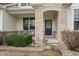 Inviting front porch with charming stone archway, stylish door, and decorative wreath at 10264 Normandy Way, Fishers, IN 46040