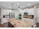 Stylish kitchen with stainless steel appliances, granite island, and ample storage space at 10264 Normandy Way, Fishers, IN 46040