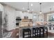 Modern kitchen with stainless steel appliances, granite countertops, and breakfast bar at 10264 Normandy Way, Fishers, IN 46040