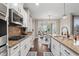 Well-designed kitchen features granite countertops and stainless steel appliances at 10264 Normandy Way, Fishers, IN 46040