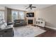Inviting living room features a fireplace, mounted TV, and comfortable seating area at 10264 Normandy Way, Fishers, IN 46040