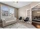 Comfortable living room with a white sofa, chandelier, and open doorway at 10264 Normandy Way, Fishers, IN 46040