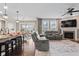 Open-concept living space with hardwood floors, comfortable seating, and stylish kitchen island at 10264 Normandy Way, Fishers, IN 46040