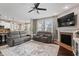 Bright and airy living room with fireplace, large windows, and open concept design at 10264 Normandy Way, Fishers, IN 46040