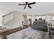 Comfortable living room leading to the staircase and an open view of the kitchen area at 10264 Normandy Way, Fishers, IN 46040