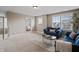 Cozy living room showcases blue sofas, neutral walls, large windows, and a decorative coffee table at 10264 Normandy Way, Fishers, IN 46040