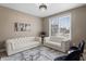 Cozy living room featuring elegant white sofas, a chandelier, and natural light at 10264 Normandy Way, Fishers, IN 46040