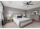 Spacious main bedroom with a tray ceiling, carpet flooring, and a view of a dresser with a mirror at 10264 Normandy Way, Fishers, IN 46040