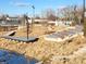 Outdoor amphitheater includes a stage, tiered seating, a stream, and a pedestrian bridge at 1030 Macoun Dr, Westfield, IN 46074