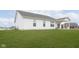 Spacious backyard with lush green lawn and covered patio, perfect for outdoor relaxation at 1030 Macoun Dr, Westfield, IN 46074