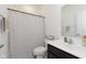 Bright bathroom with white sink, modern fixtures, and snowflake patterned shower curtain at 1030 Macoun Dr, Westfield, IN 46074