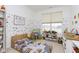 bedroom featuring a window, bed with printed bedding, toy decor, and shelving at 1030 Macoun Dr, Westfield, IN 46074