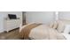 Bright bedroom featuring wood floors, a large window, a dresser, and a comfortable bed at 1030 Macoun Dr, Westfield, IN 46074