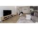Spacious living area with a comfortable armchair, entertainment center, and stylish decor at 1030 Macoun Dr, Westfield, IN 46074