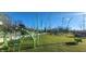 Fun playground features a climbing web, rope structures, and grassy play surface at 1030 Macoun Dr, Westfield, IN 46074