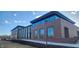 Modern public library building with large windows, brick facade, and landscaped grounds at 1030 Macoun Dr, Westfield, IN 46074