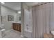 Bathroom with a shower-tub combination and wood vanity at 10329 Gateway Dr, Indianapolis, IN 46234