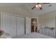 Bedroom featuring a ceiling fan and double door closet at 10329 Gateway Dr, Indianapolis, IN 46234