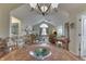 Open dining area showcasing hardwood floors and access to the kitchen and living room at 10329 Gateway Dr, Indianapolis, IN 46234