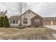 Charming home with a mix of brick and vinyl siding at 10329 Gateway Dr, Indianapolis, IN 46234