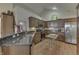 Open kitchen features granite counters, stainless appliances, and ample cabinet space at 10329 Gateway Dr, Indianapolis, IN 46234