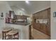 Modern kitchen features dark wood cabinets, granite countertops, and stainless steel appliances at 10329 Gateway Dr, Indianapolis, IN 46234