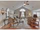 Cozy living room featuring a fireplace, vaulted ceilings, and hardwood flooring at 10329 Gateway Dr, Indianapolis, IN 46234