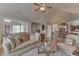 Comfortable living room showcasing stylish seating, a glass coffee table, and hardwood floors at 10329 Gateway Dr, Indianapolis, IN 46234