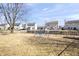 Large backyard with mature trees and a play structure, perfect for outdoor activities and Gathering fun at 10373 Cerulean Dr, Noblesville, IN 46060