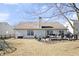 Backyard view of a home with a deck, patio, lawn, and fence for outdoor living at 10373 Cerulean Dr, Noblesville, IN 46060